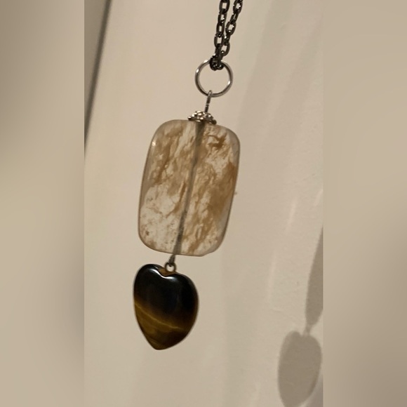 Rutilated quartz and a tigereye heart combine for a striking pendant. 2.75” - Picture 5 of 5